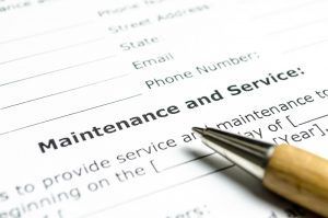 close-up of pen and maintenance and service contract