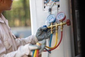 technician repairs restaurant’s hvac system