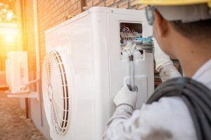 technician repairs store’s AC